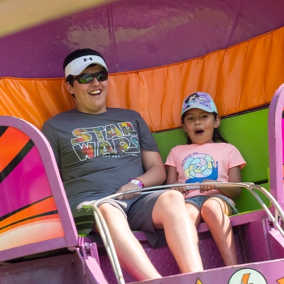 Parents and children enjoy rides together at Famiily Night on July 2.