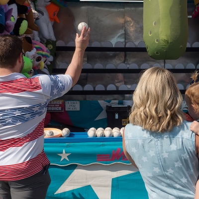 Test your athletic skills at one of the many booths along the Midway.