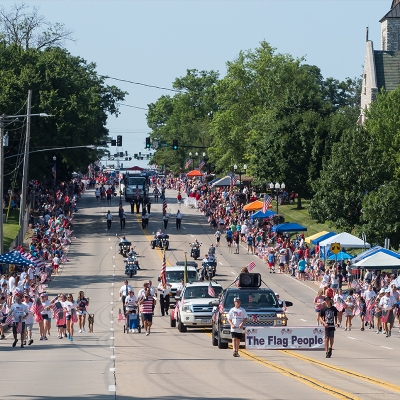Crowds line both sides of Main Street as the parade proceeds north to the festival grounds.